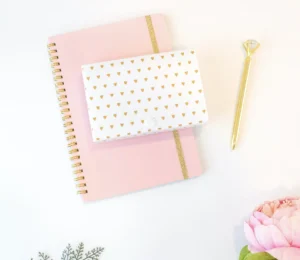 This image displays a photo with vibrant colors, including shades of pink, gold, and green.